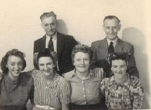 James Mabbott, at rear, with Iris ,stripe dress,  Joan Mabbott next to her.