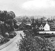 Late 1940s/early 50s view of the lower end of Tockington - (Little Farm in sight - Lower Farm beyond) Willow Farm directly over the road from Little Farm in amongst the clump of trees. The driveway to The Grove House middle left.  Today, Little Farm has three gables! - Photograph provided by David Drew-Smythe, Sydney, Australia